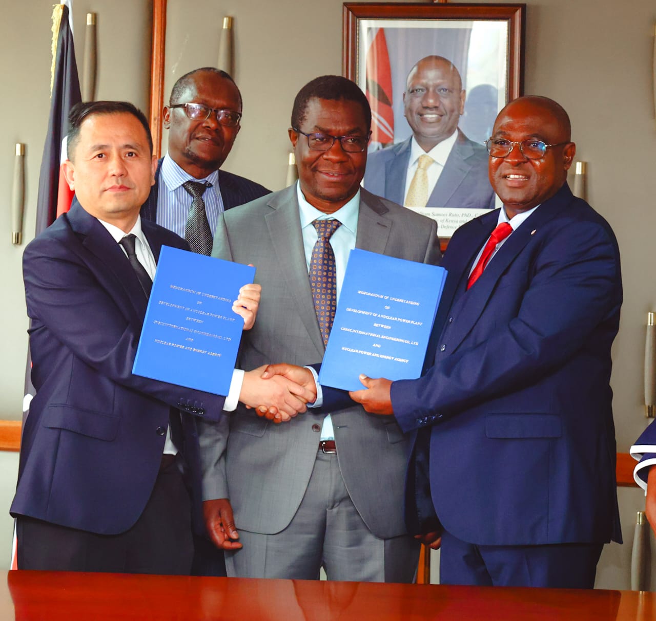  Nuclear Power and Energy Agency (NUPEA) Chief Executive Officer Justus Wabuyabo (Seated R) and the President of the China Nuclear Engineering and Construction Corporation (CNECC) International, Li Xiaohong (seated L) sign a Memorandum of Understanding on collaboration on technical transfer in Nuclear energy implementation and development towards nuclear power programs in Kenya